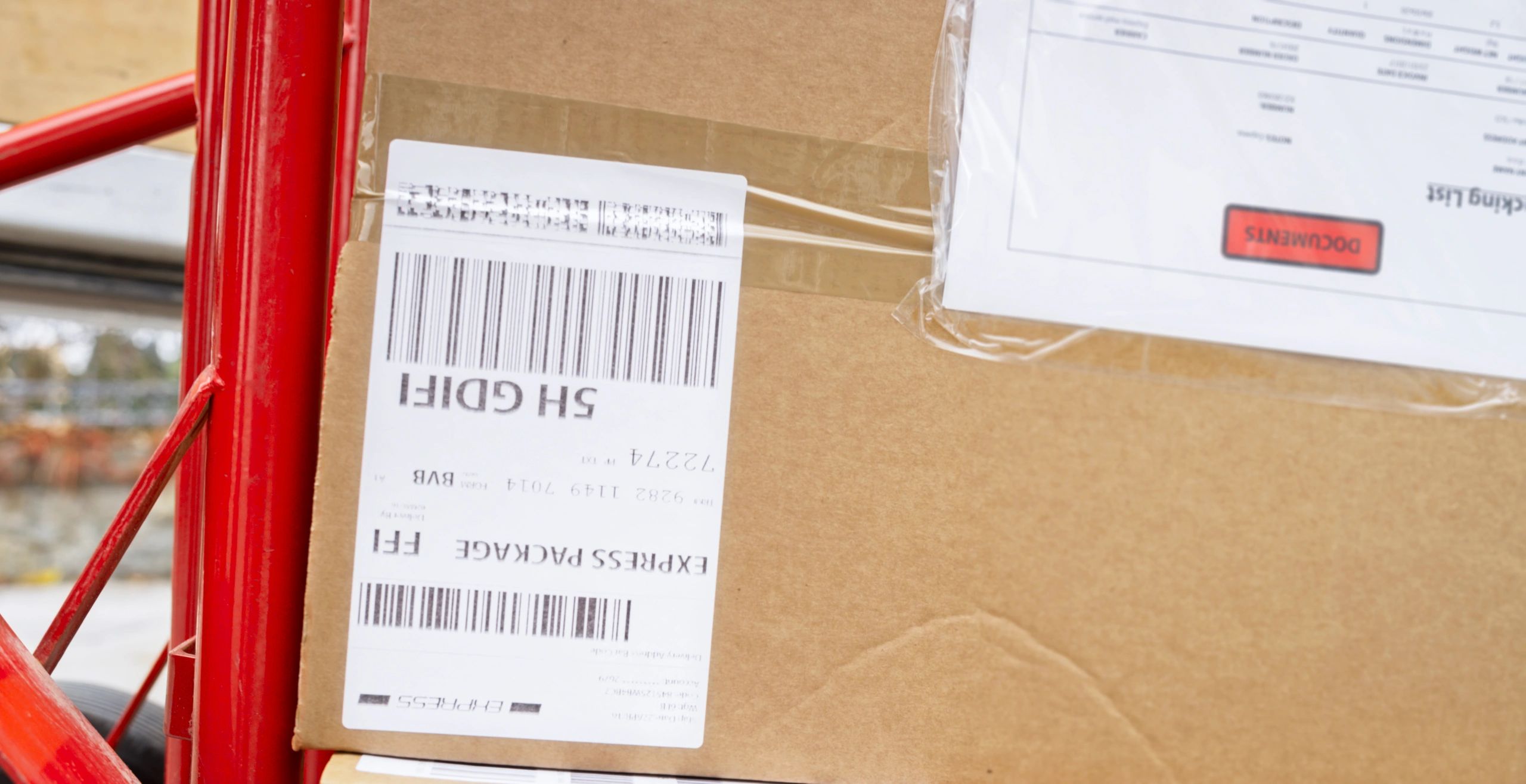 Close-up of a shipping label barcode on a box