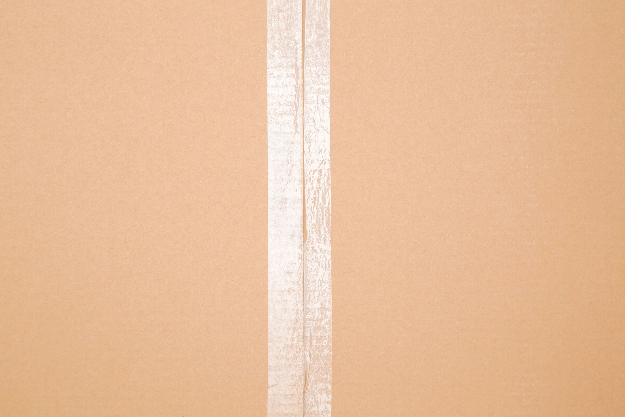 Sealed small box with packing tape ready for shipping